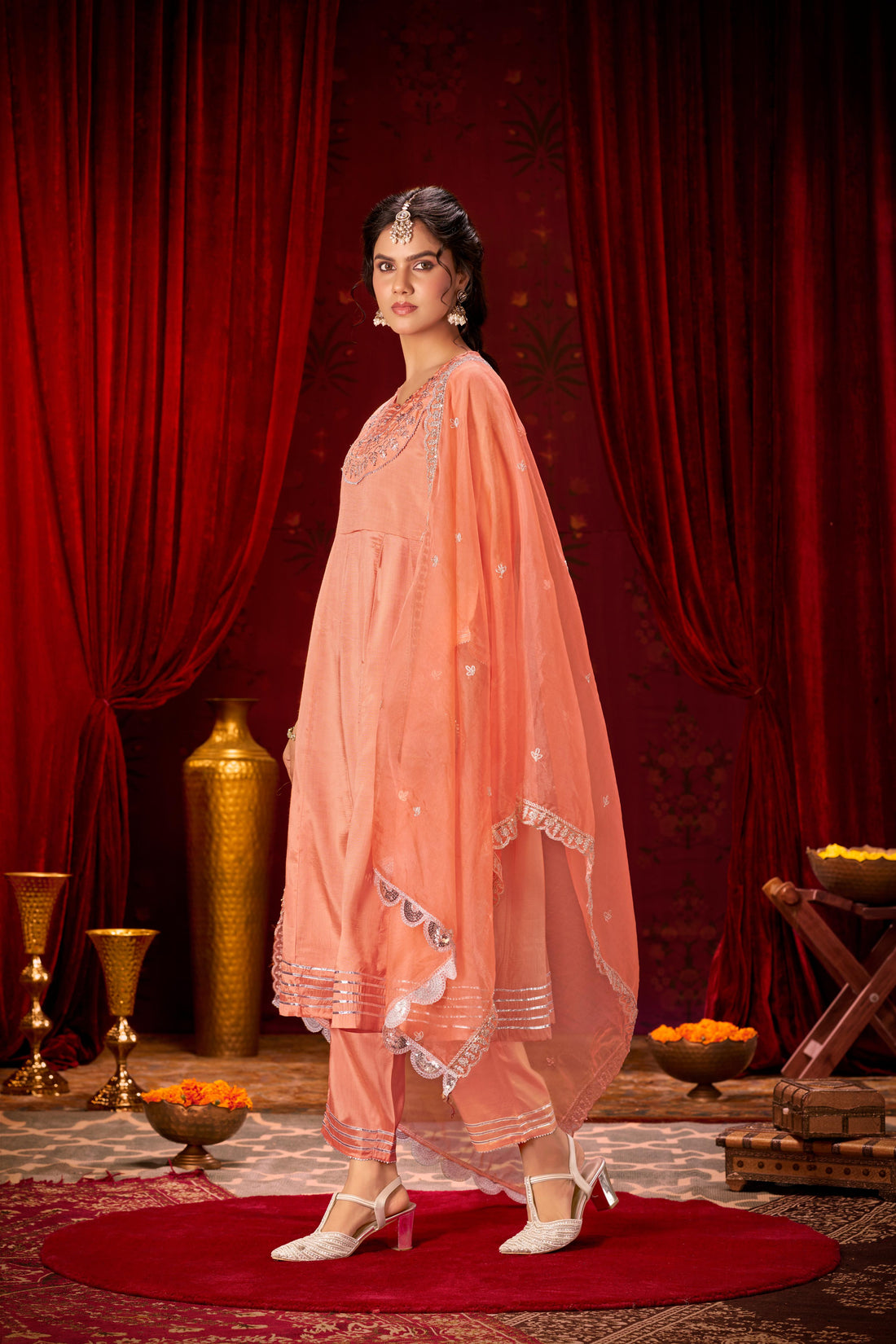 Indu Peach Handcrafted Zari Thread, Sequin & Glass Bugle Embellished Suit Set with Detailed Neckline and Dupatta in Pure Muslin with Pure Cotton Mul Lining