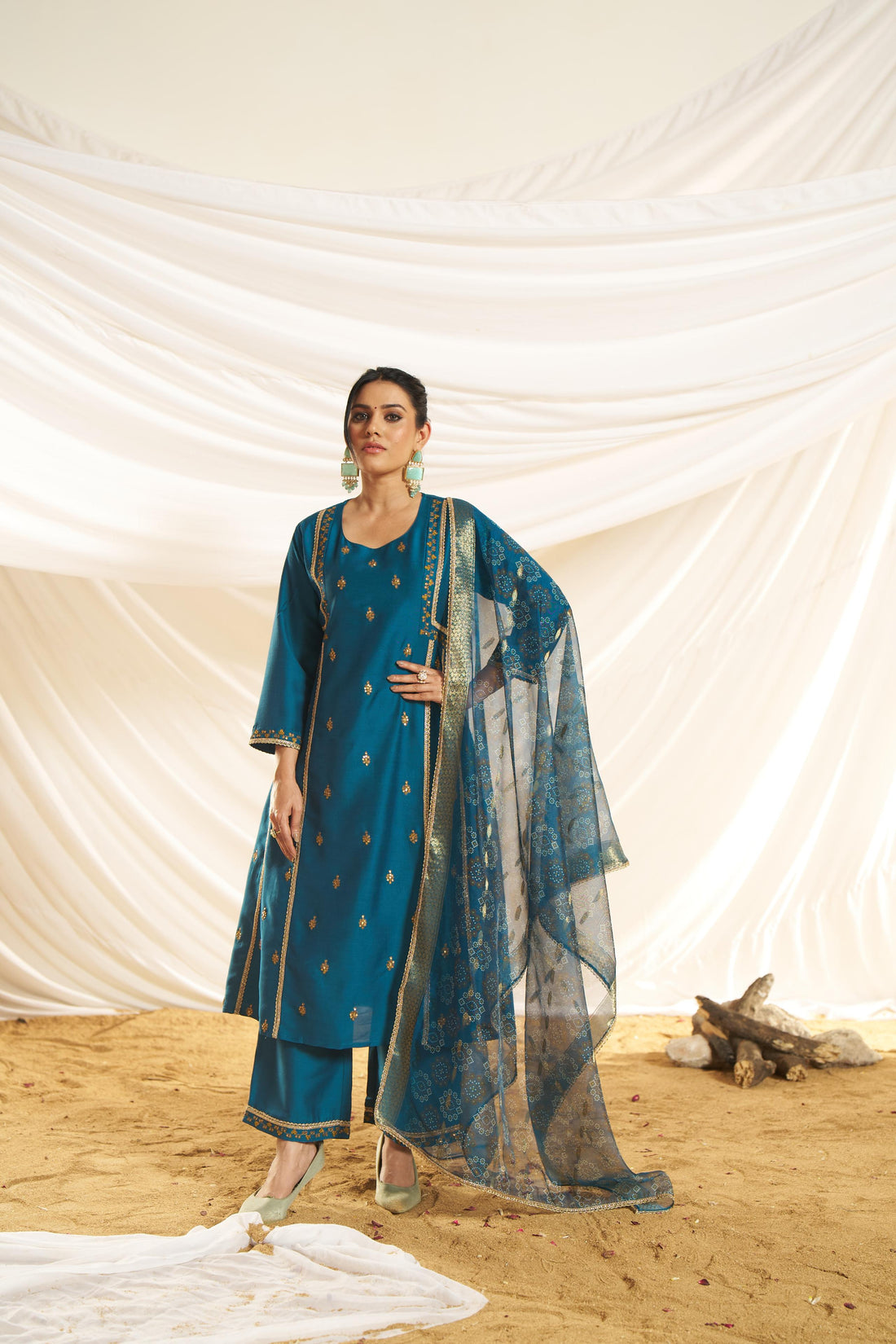 Kayra Teal Sequins Motif Work A-Line Suit Set with Lace Border Detail in Chinnon Silk with Pure Cotton Mul Lining