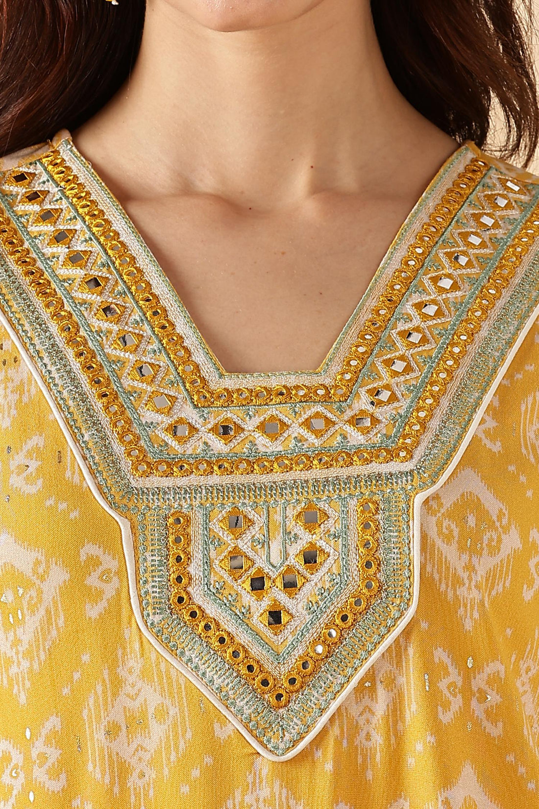 Sagarika Printed Yellow & Off White Salwar Suit with Hand Embroidered Mirror Work Neckline in Viscose