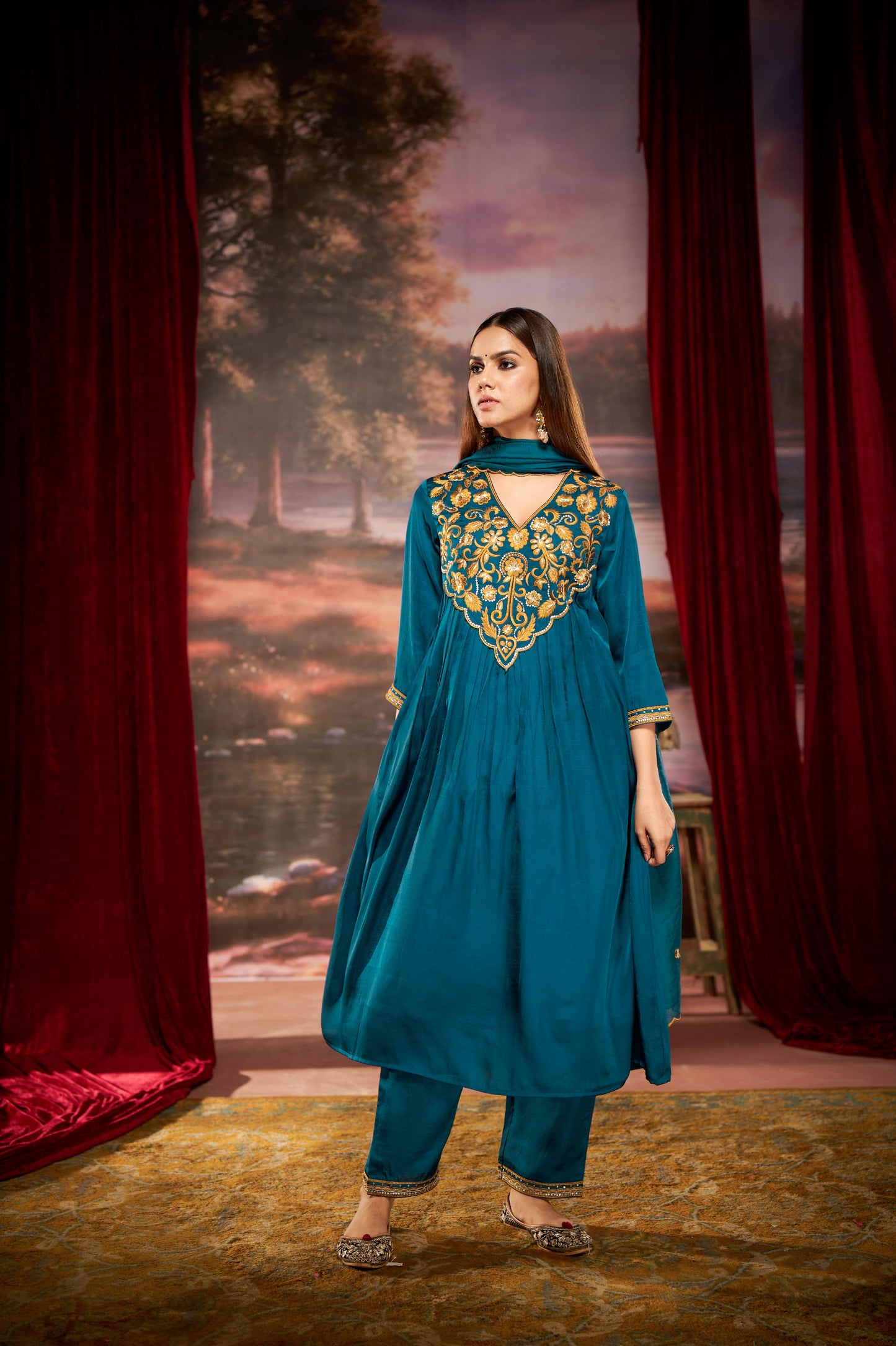 Raajvee Peacock Blue Pure Silk Suit Set with Dupatta and Cotton Mul Lining Featuring Handcrafted Resham and Zari Embroidery with Sequin Embellished Designer Neckline