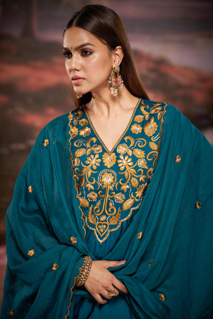 Raajvee Peacock Blue Pure Silk Suit Set with Dupatta and Cotton Mul Lining Featuring Handcrafted Resham and Zari Embroidery with Sequin Embellished Designer Neckline