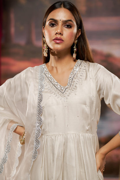 Raajvee Ivory Pure Silk Kurta Set with Cotton Mul Lining Featuring Handcrafted Zari, Sequin, Pearl & Glass Bugle Embellished V-Neck with Organza Dupatta