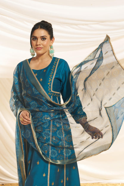 Kayra Teal Sequins Motif Work A-Line Suit Set with Lace Border Detail in Chinnon Silk with Pure Cotton Mul Lining