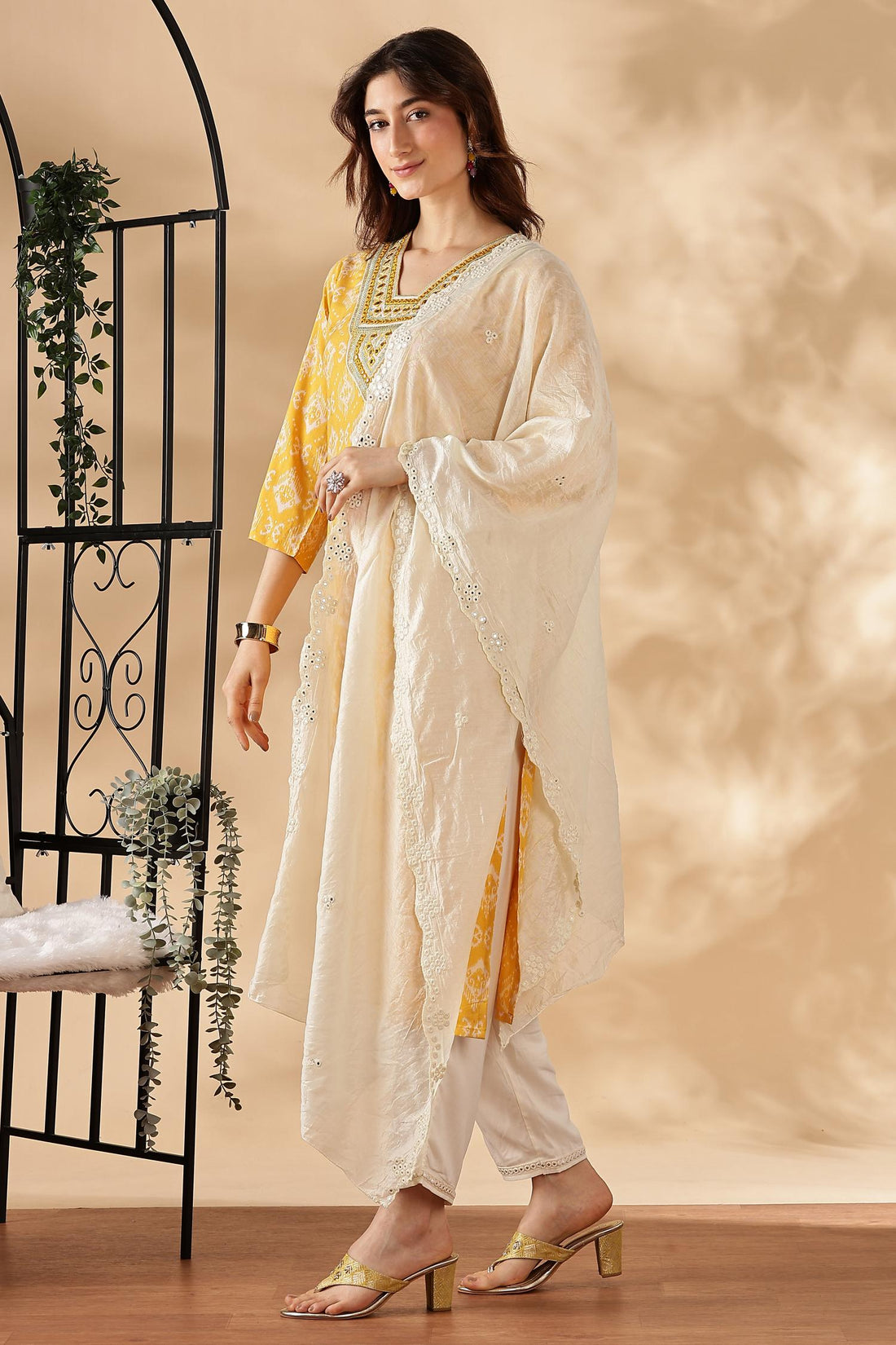 Sagarika Printed Yellow & Off White Salwar Suit with Hand Embroidered Mirror Work Neckline in Viscose