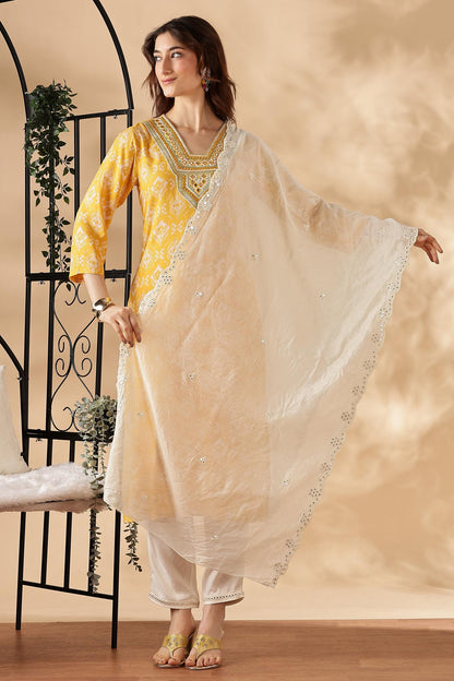 Sagarika Printed Yellow & Off White Salwar Suit with Hand Embroidered Mirror Work Neckline in Viscose