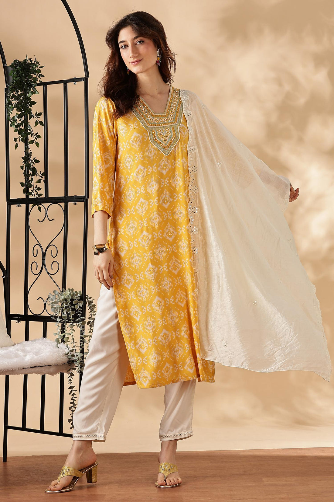 Sagarika Printed Yellow & Off White Salwar Suit with Hand Embroidered Mirror Work Neckline in Viscose