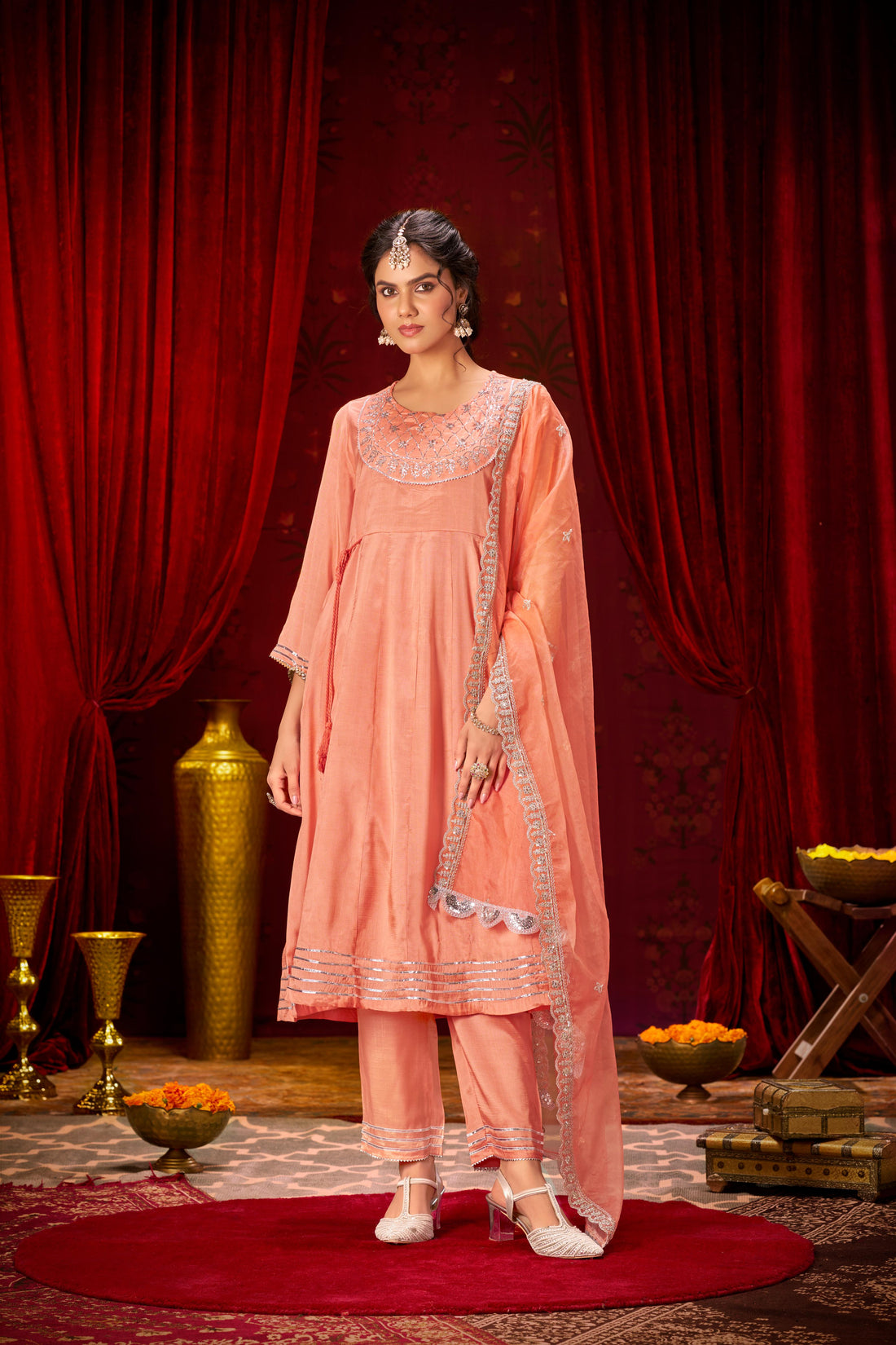 Indu Peach Handcrafted Zari Thread, Sequin & Glass Bugle Embellished Suit Set with Detailed Neckline and Dupatta in Pure Muslin with Pure Cotton Mul Lining