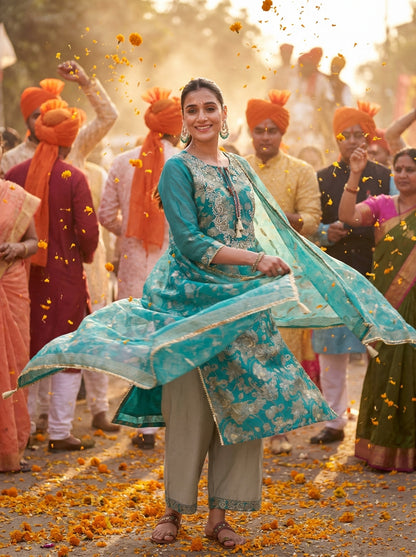 Shehnaaz Rama Hand Embellished Zari, Sequins & Moti Neck Work Suit Set with Tassel Detail in Chanderi Silk with Pure Cotton Mul Lining