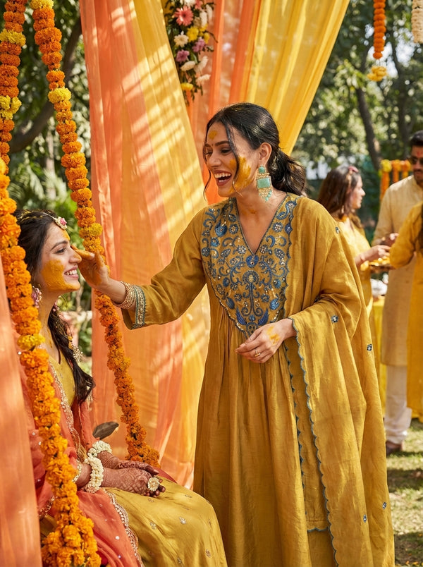 Raajvee Mustard Pure Silk Suit Set with Dupatta and Cotton Mul Lining Featuring Handcrafted Resham and Zari Embroidery with Sequin Embellished Designer Neckline