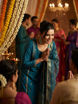 Kayra Teal Sequins Motif Work A-Line Suit Set with Lace Border Detail in Chinnon Silk with Pure Cotton Mul Lining